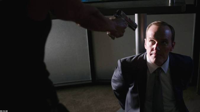 Agent Coulson is betrayed and held at gunpoint.